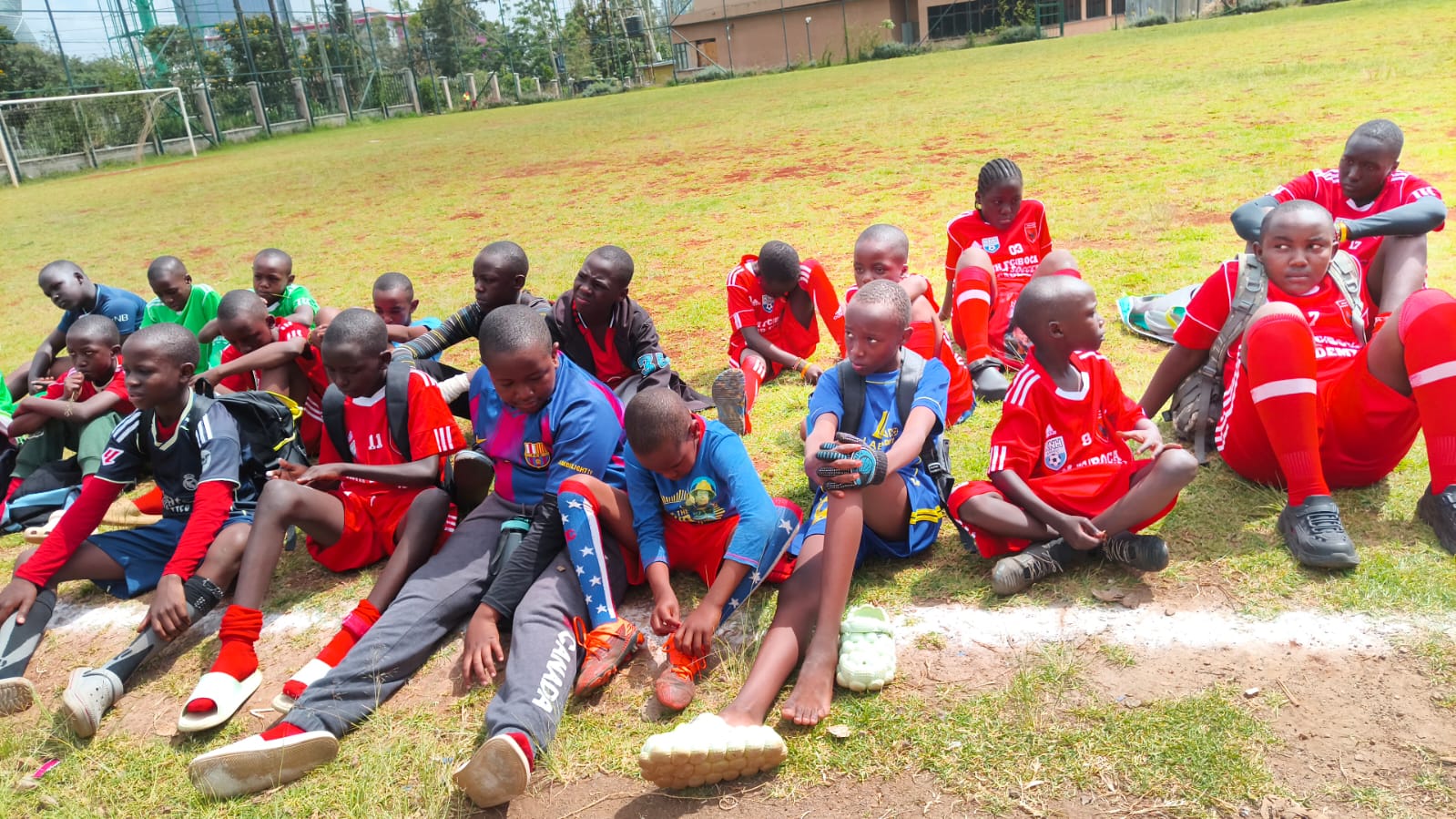 Young players resting on sideline